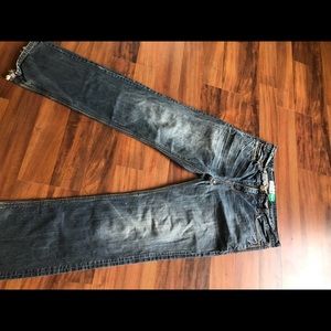 Men’s faded blue jeans